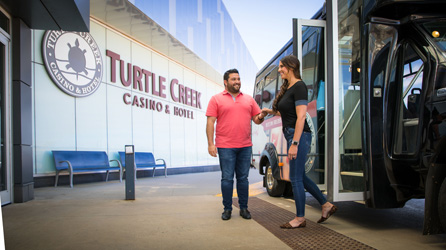 Couple decending the Turtle Creek Casino Shuttle